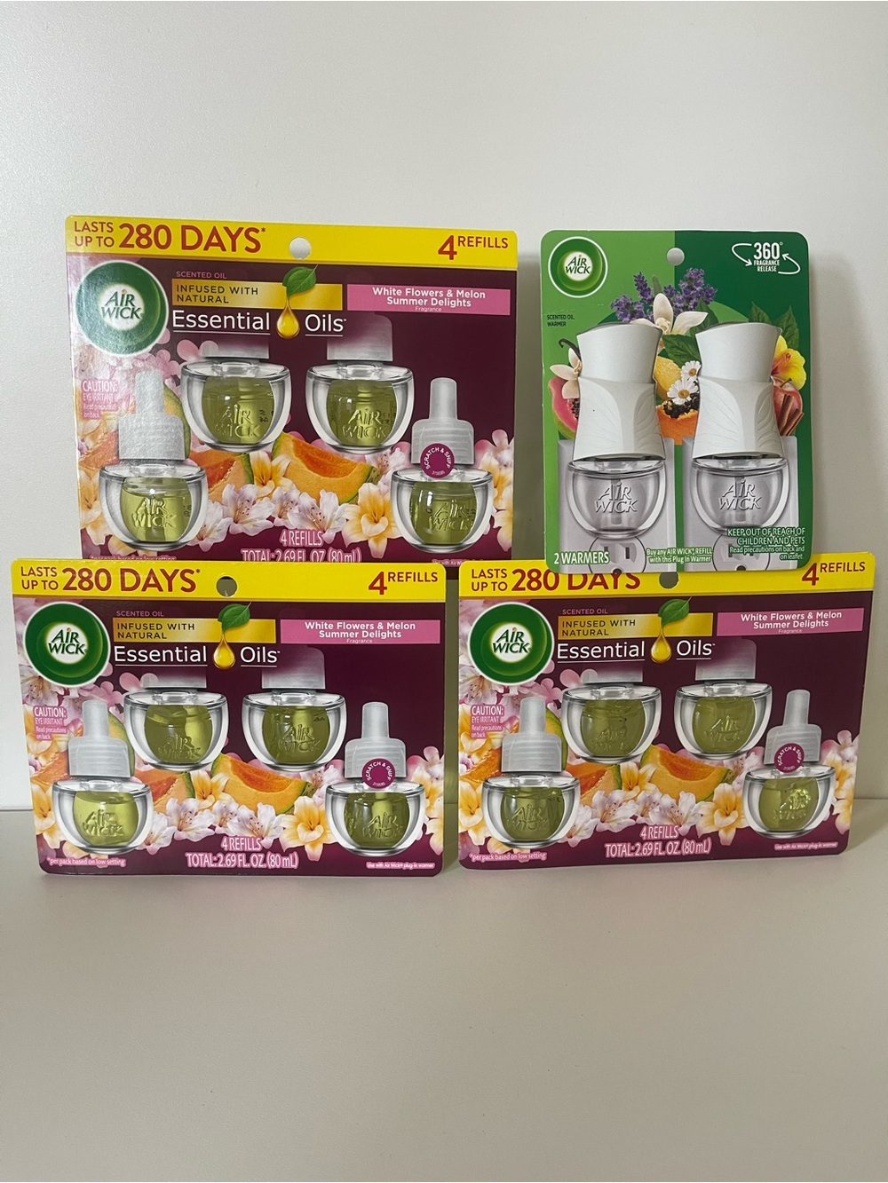 Air Wick Plug-In Oil Refills , White Flowers & Melon ( 12 Refills + 2 Warmer )